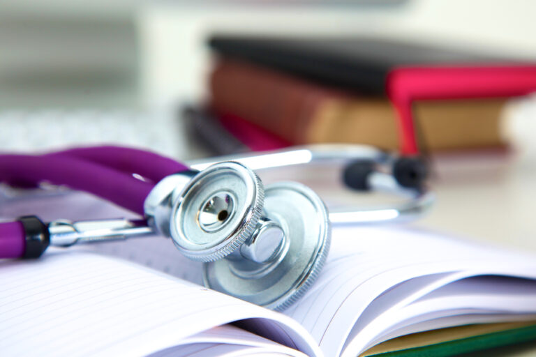 stethoscope laying on a book