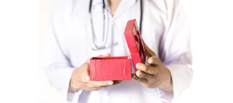 doctor opening a small red box