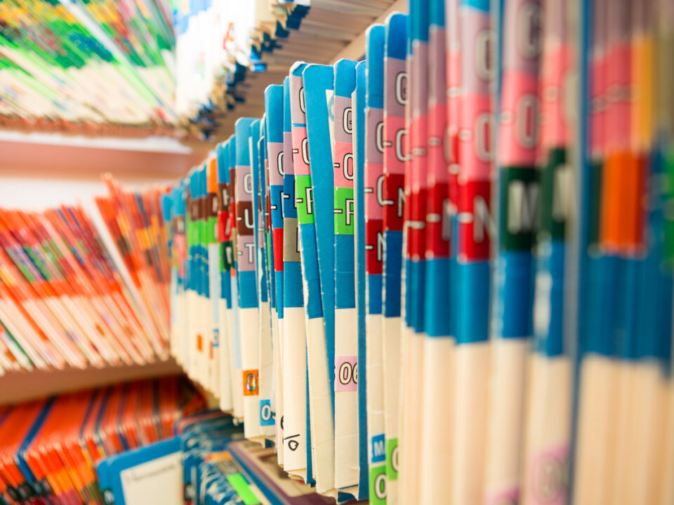 Shelf filled with manila folders