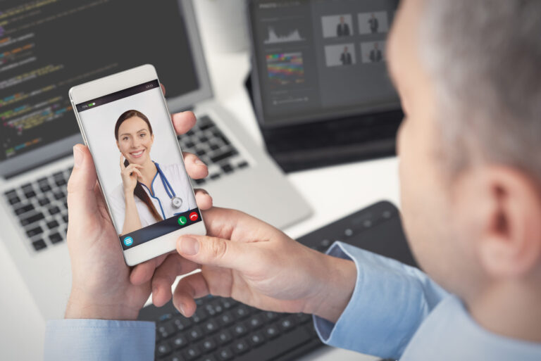 man talking to doctor on phone video chat