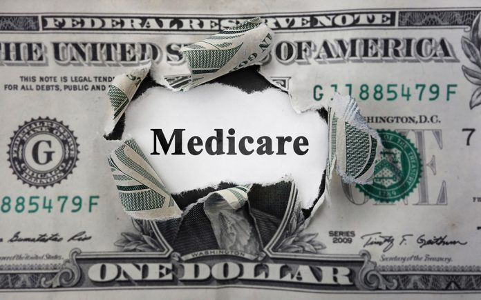 dollar bill with hole in the middle that says medicare