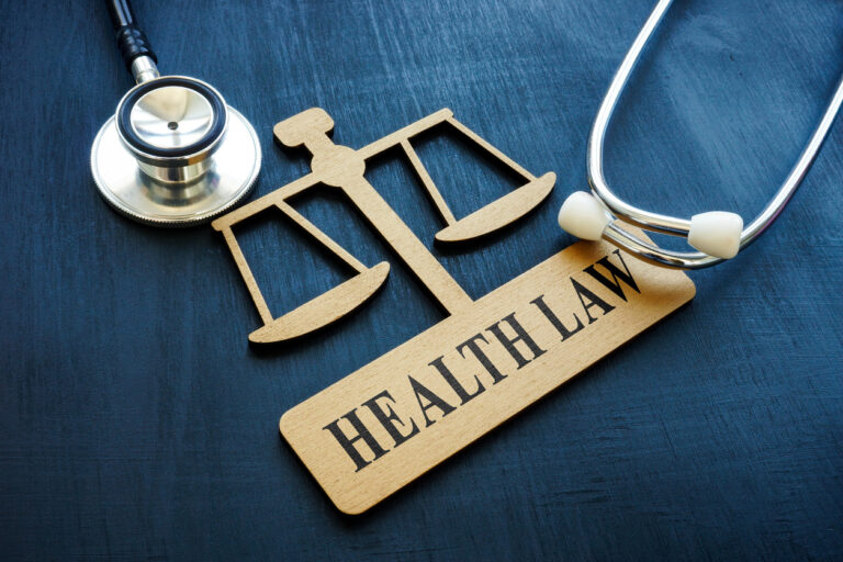 A plate in the form of scales with a health law sign