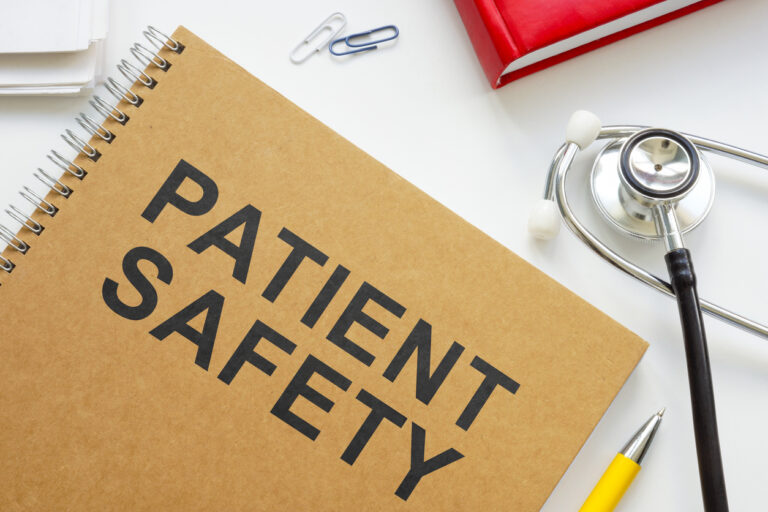 patient safety book and stethocope