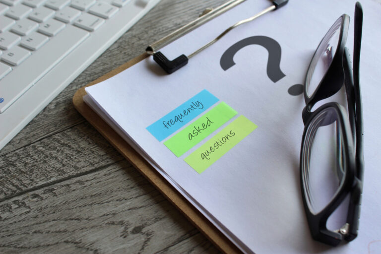Frequently Asked Questions written on sticky notes