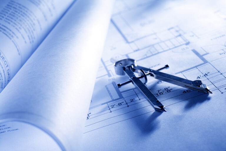 compass laying on blueprints