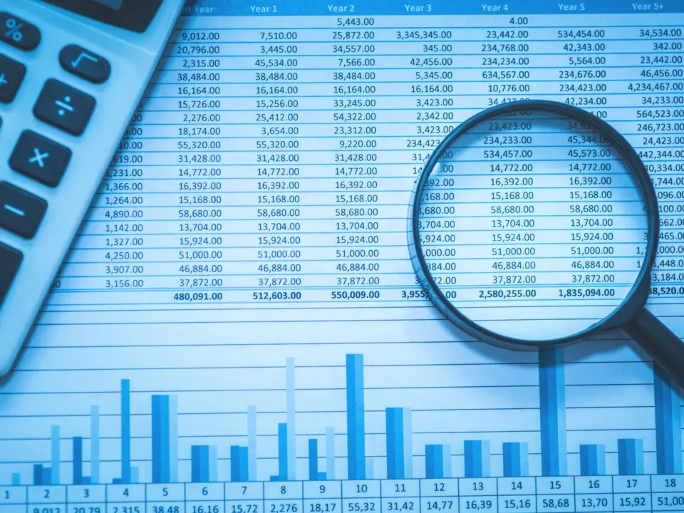 reports with magnifying glass