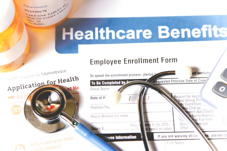 Health care benefits employee enrollment form with stethoscope