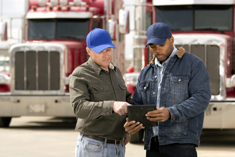 Truck Driver Reviewing Tablet Computer
