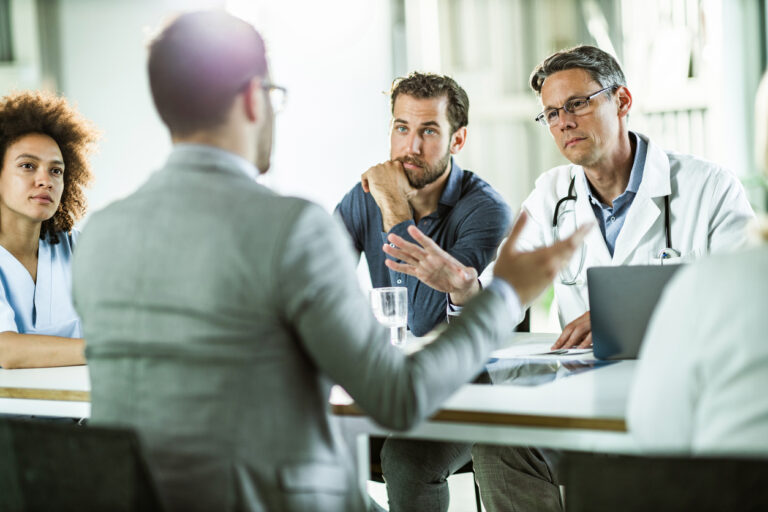 business people meeting with physician