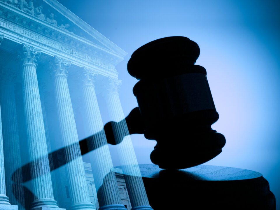 A gavel and the United States Supreme Court building.